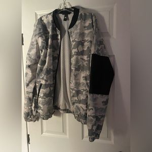 Adidas long sleeve jacket is a size XL.